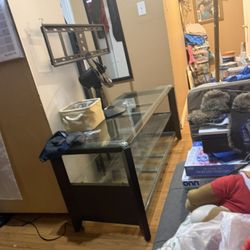 Glass TV stand / media console with shelves.