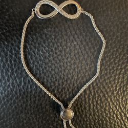 New In Box. ZALES JEWELER 1/10TCmW DIAMOND INFINITY STERLING SILVER CHAIN BRACELET