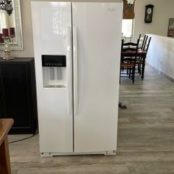Whirlpool side-by-side white refrigerator
