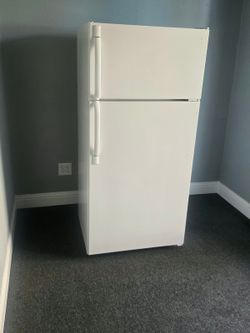 GE white top and bottom refrigerator.