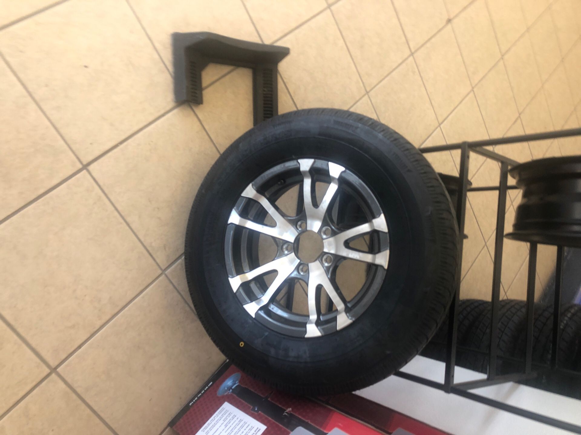 Trailer tire and rim. 15” 5 lug. 205/75/15 Radial. Warranty.