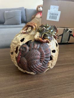 Beautiful ceramic turkey and pumpkin candle holder.