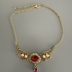 Women’s signed golden and red Necklace