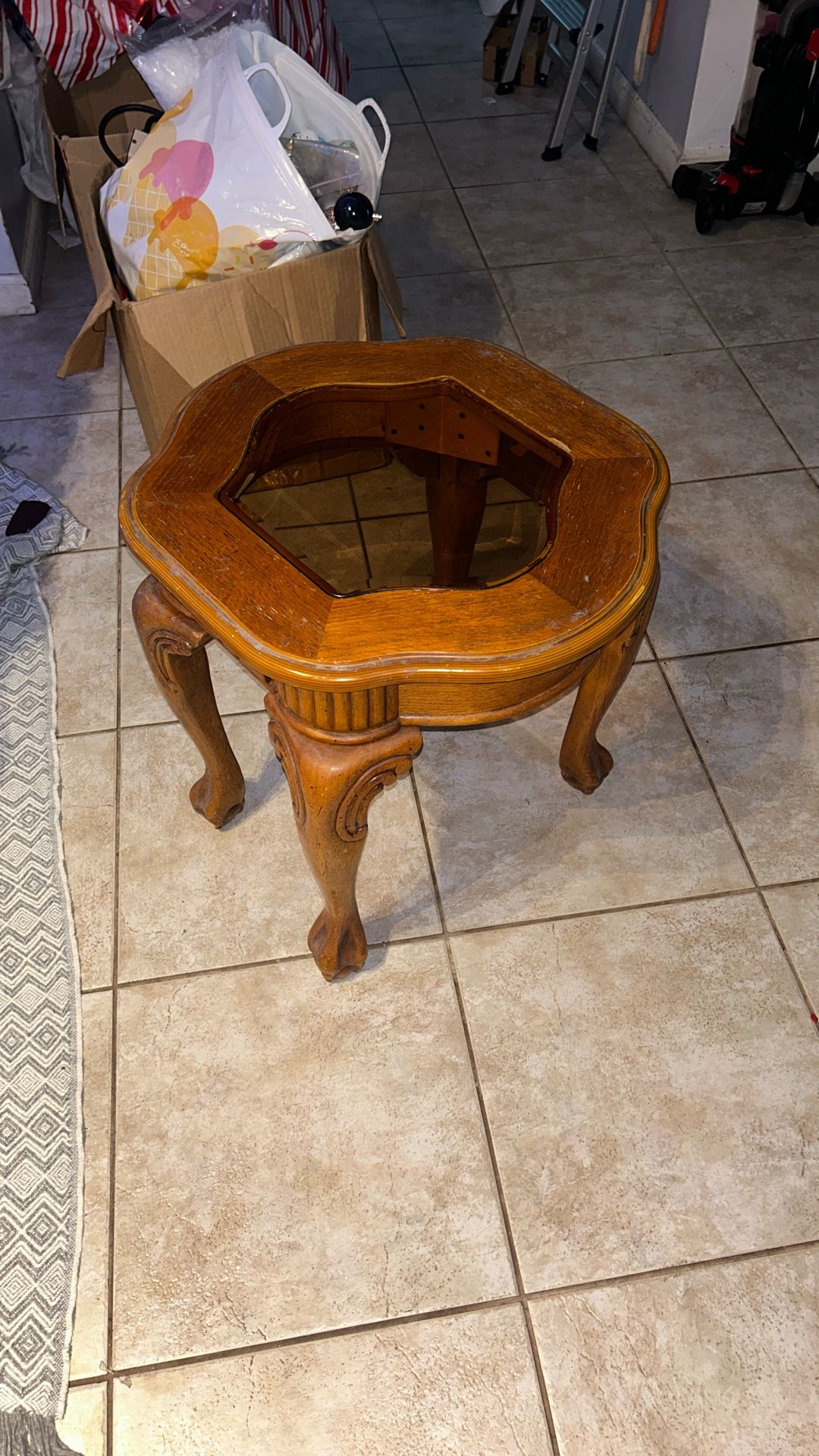 carved wood and glass accent end table with cabriole legs