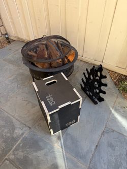 Fire pit with wood and random workout equipment