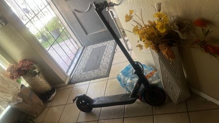 Black Electric Kick Scooter with Red Wheels
