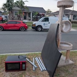 Microwave, IKEA Corner Desk, And A Cat Tree