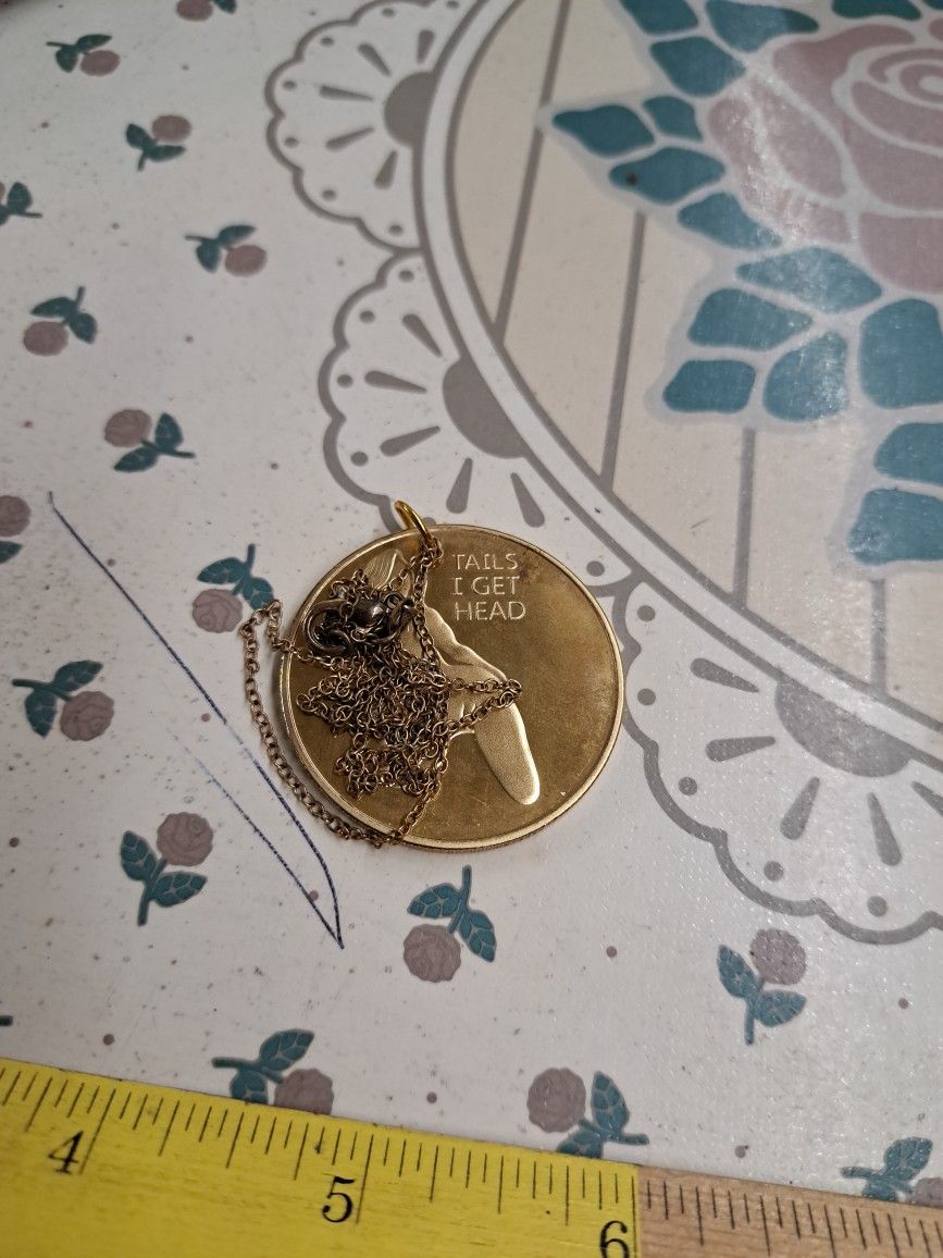 Tails and head medallion.