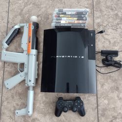 PlayStation 3 console w/ games 
