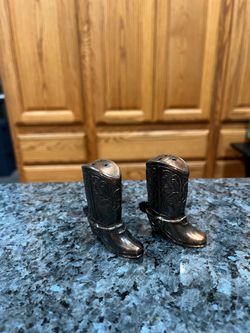 Vintage Cowboy Boot Shaped Metal Pair of Salt and Pepper Shakers.  Preowned never used.  Size approximately 2 1/2 inches tall.
