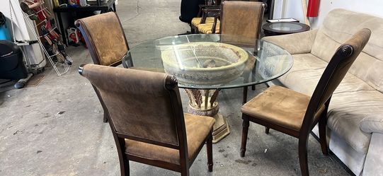 Heavy glass dining table with four chairs Heavy glass dining table with four chairs