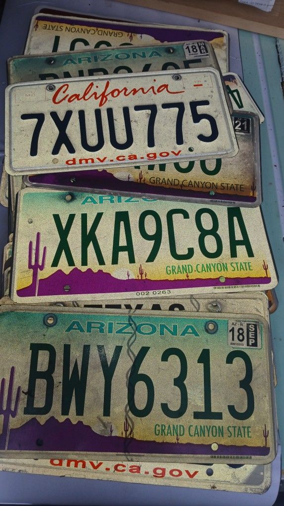33 used vehicle license plates from various states. Mostly Arizona.