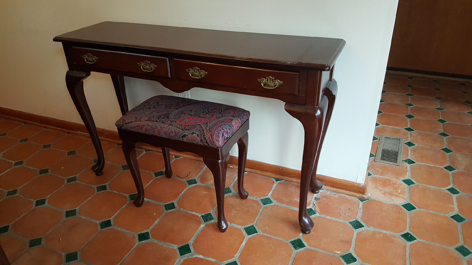 Cherry table with bench can be used in foyer as an entry table or as a dressing table.