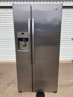 GE side-by-side stainless steel refrigerator in good condition, clean and nice. One month warranty. Delivery available. Dimensions: W33-D31-H69