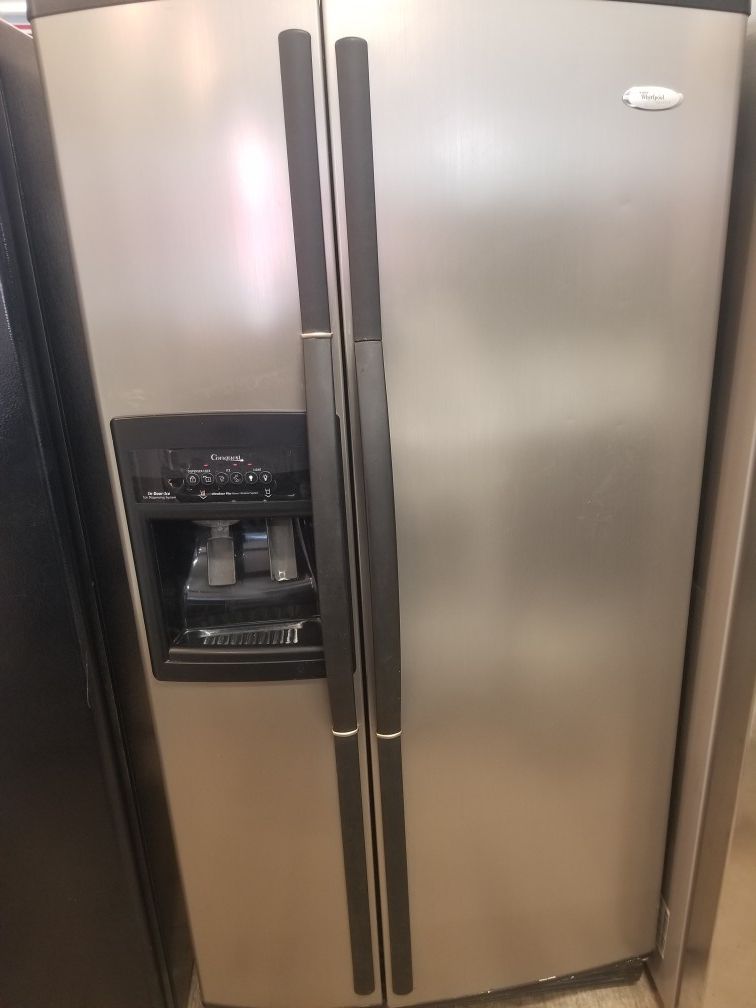 Whrilpool side by side stainless steel refrigerator