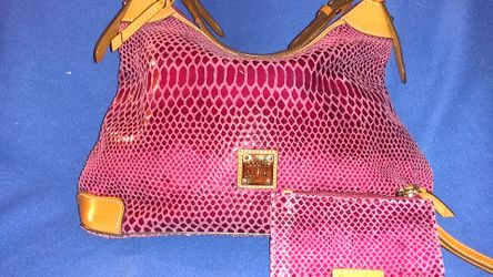 This a pinkish color snake enbosed hobo bag