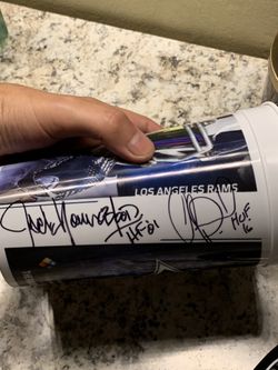 Rams NFL Cup autographed by Jack Youngblood and Orlando Pace