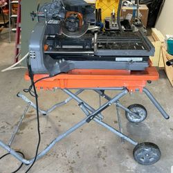 10" WET AND DRY RIDGID TILE TABLE SAW WITH ROLLING  STAND 