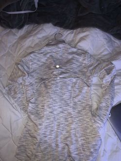 A bunch of clothes and size 7.5 vans