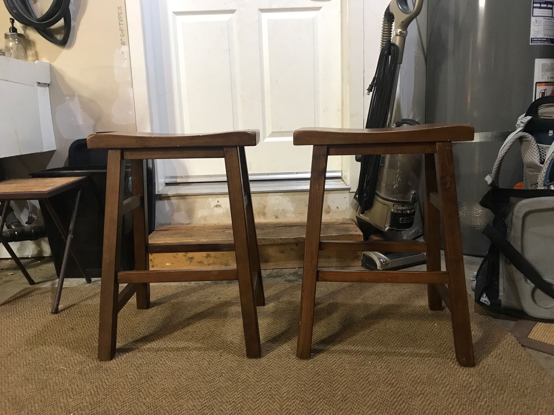 Two wooden bar stools