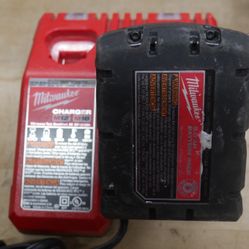 MILWAUKEE CHARGER 48-59-1812 W 5AH BATTERY USED 884283-7
