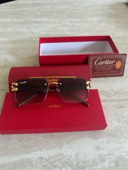 Gold and black Cartier glasses