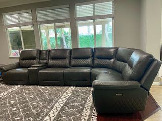 Leather sectional couch with motorized recliners