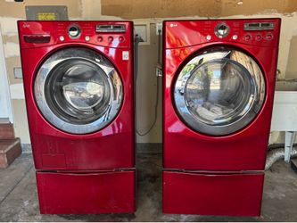 Red LG wash and dryer with storage pedestals