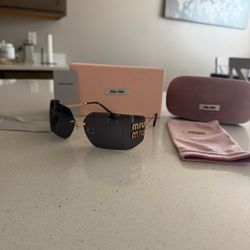 Miu Miu Rimless Sunglasses