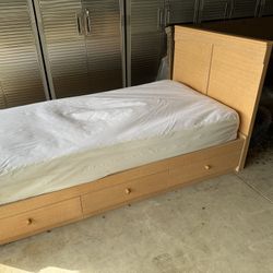 Twin bed frame with storage drawers and headboard and mattress with allerease cover in excellent condition. 