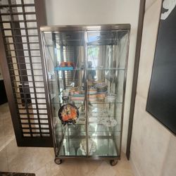 Hi End Stunning curio Cabinet- Glass/stainless/ On Casters- New Over 5k