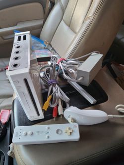 Nintendo wii system with controller and cords also backward compatible working perfectly.