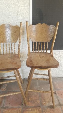 2 oak swivle bar stools