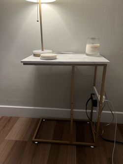 marble and gold side table wit h outlet