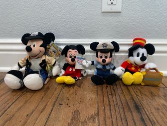 Disney’s plush Mickey as policeman, director, bellhop and original Beanies.