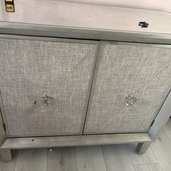 Cabinet With Upholstered Front Panel And Mirror Top