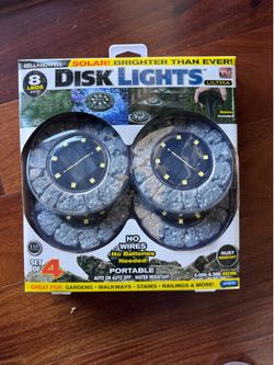 BELL + HOWELL 4-Pack Disk Lights Ultra 80 - Lumens Dark grey Solar Integrated LED Path Light with Dusk-to-Da..