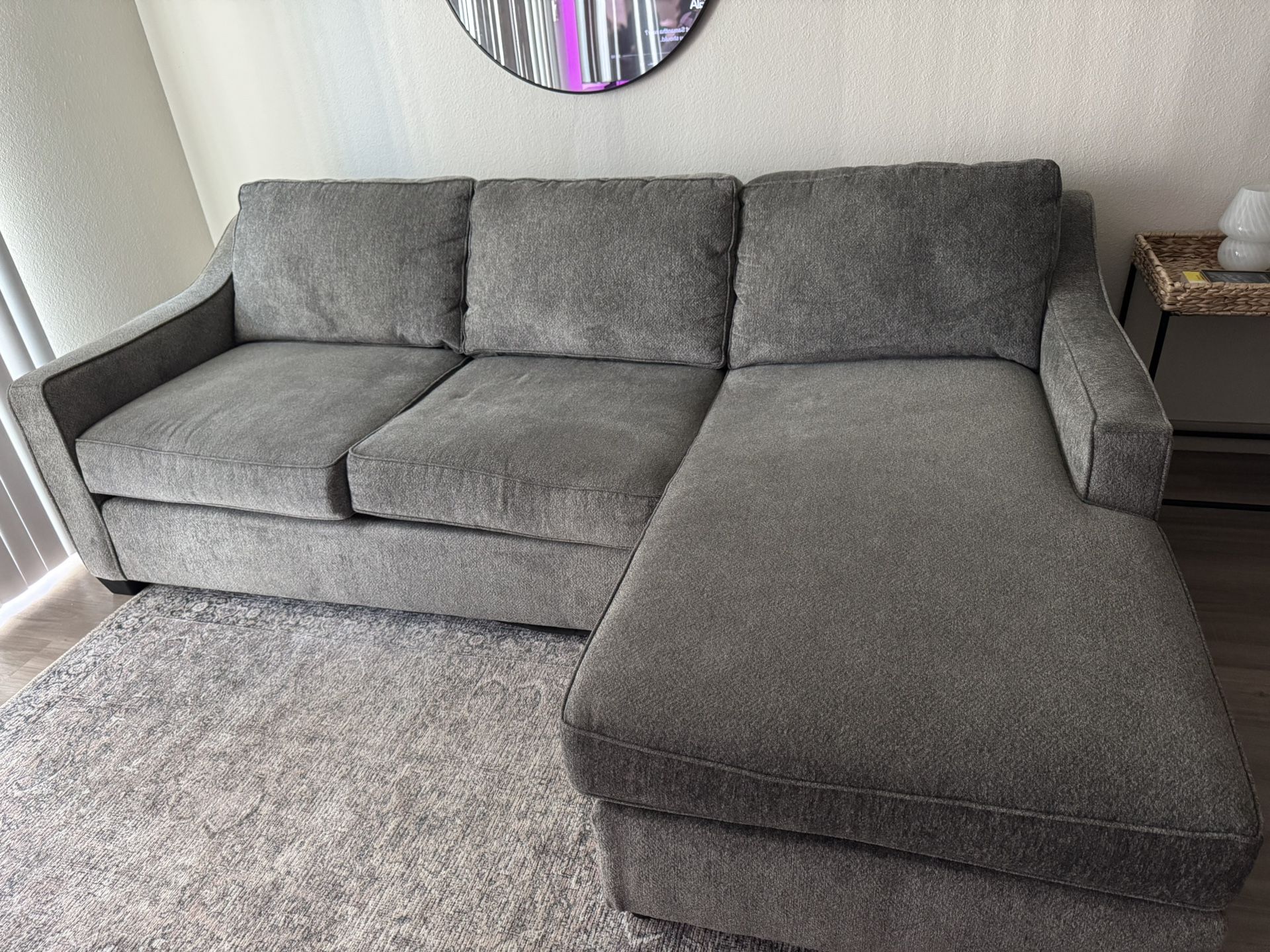 Grey Couch With Reversible Side Ottoman