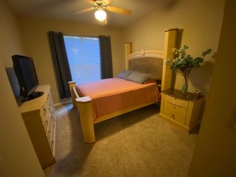 Queen size bed with mattress and one end table and one dresser