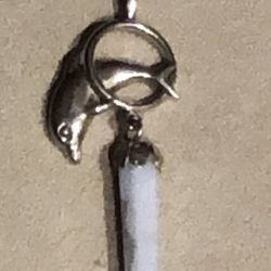 Silver Dolphin Leaping through Hoop With a White Crystal Point Hanging Pendant