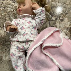 Moving doll in pajamas with matching blanket