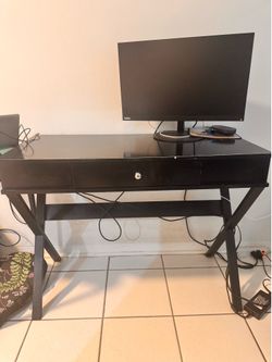 Computer Monitor and Black Desk