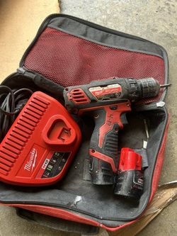 Milwaukee Drill Driver With Charger and Two Batteries In Good Condition