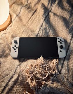 Nintendo OLED Console with White and Black Joy‑Con