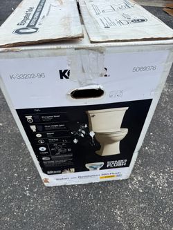 KOHLER Elliston Biscuit Elongated Chair height 12-in Rough-In WaterSense 1.28 GPF Soft Close 2-piece Toilet