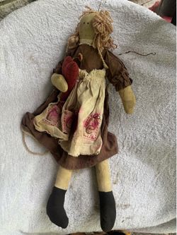 This item is a primitive-style handmade rag doll