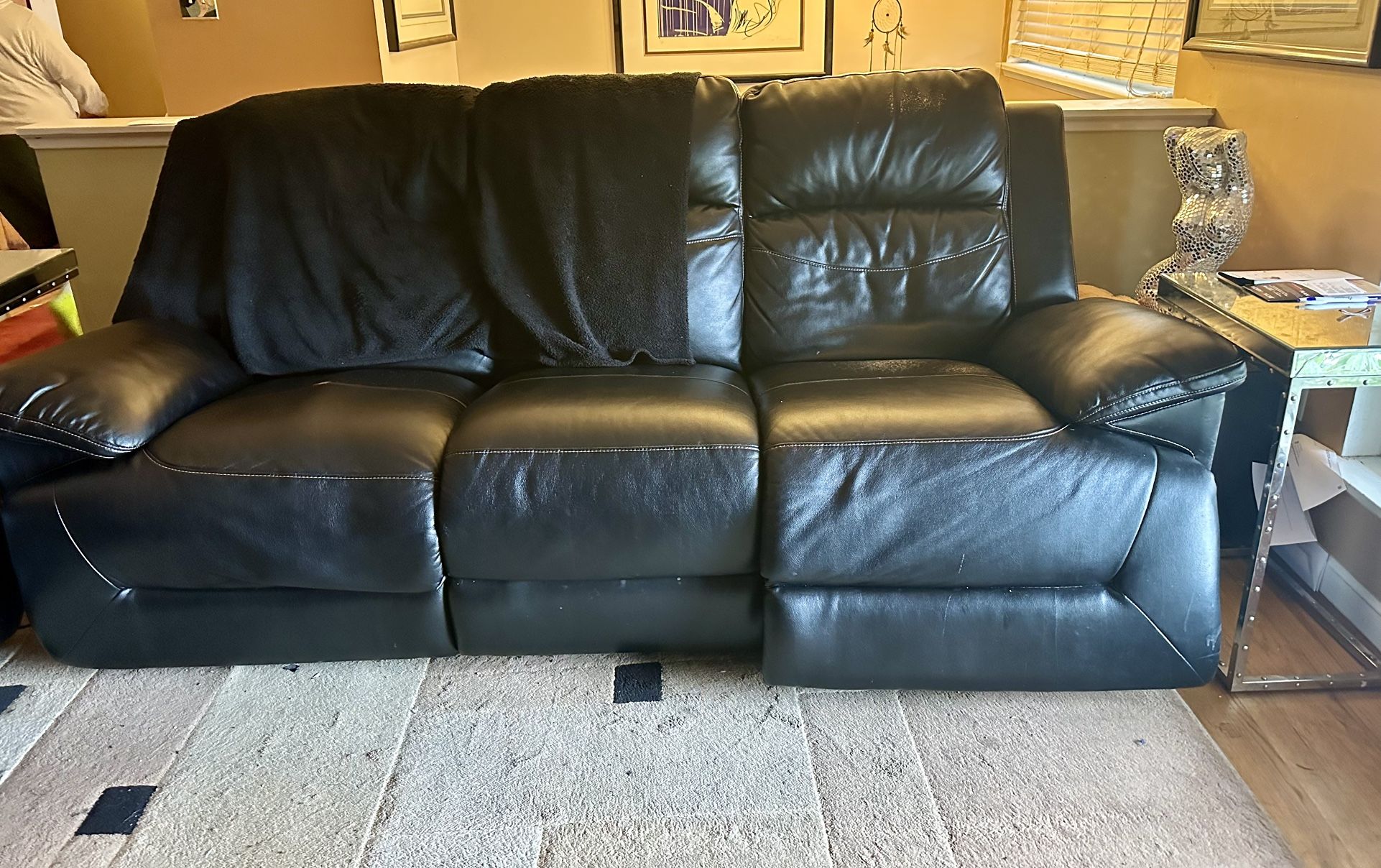 black leather couch and love seat. Both power recline with USB ports.
