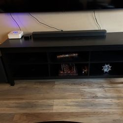 Black TV Stand, LG 86 in TV, and JBL Home Speaker 