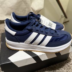 Adidas Run 70s 2.0 sneakers in a navy blue colorway featuring white stripes and Cloudfoam cushioning