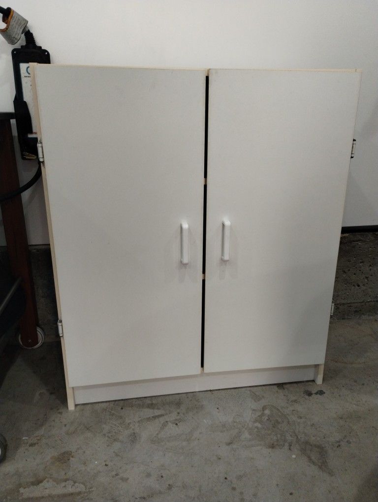 Sturdy Three Shelf Cabinet With Doors